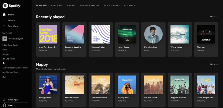 Spotify 頁面的屏幕截圖,在黑暗模式下,專輯和藝術家圖像是彩色的,文本是白色的。